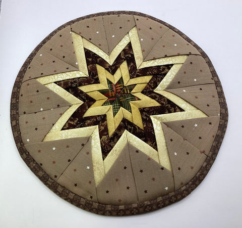 Circle quilted star pot holder 9”